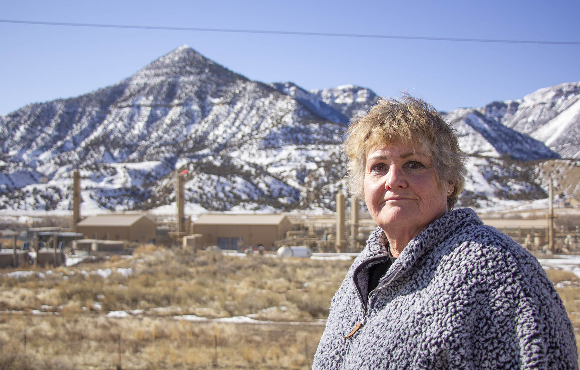 colorado resident in front of gas well